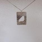 Silver Robin Pendant: A Textured Sterling Silver..