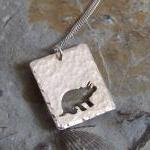 Silver Triceratops Pendant: A Textured Sterling..
