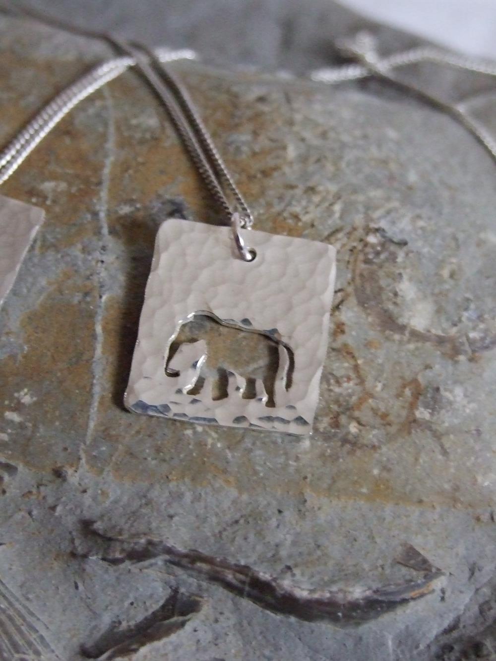 Silver Elephant Pendant: A Textured Sterling Silver Pendant Showing A Silhouette Of An Elephant