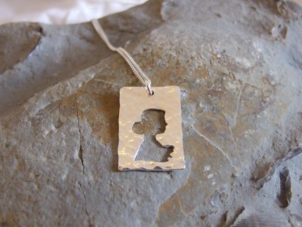 Silver Profile Pendant : A Sterling Silver Pendant Of A Silhouetted Profile Of Beautiful Woman.